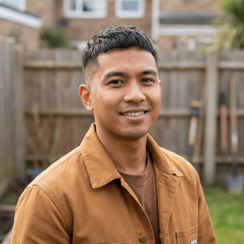 Male Airbnb host in his late 30s, Black, relaxed and trustworthy expression, casual home setting